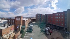 Richmond apartment for rent - a view of a parking lot in a city with buildings